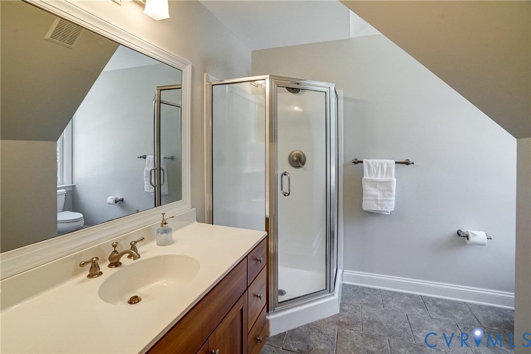 1295 Hermitage Road Manakin-Sabot, VA 23103 - Photo 52 of 55 a bathroom with a sink mirror and shower