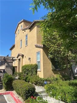 a view of a house with a small yard