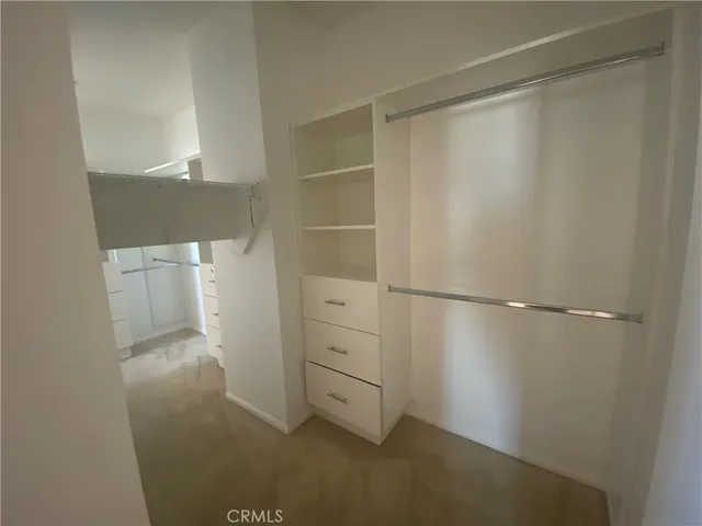 a view of an empty walk in closet