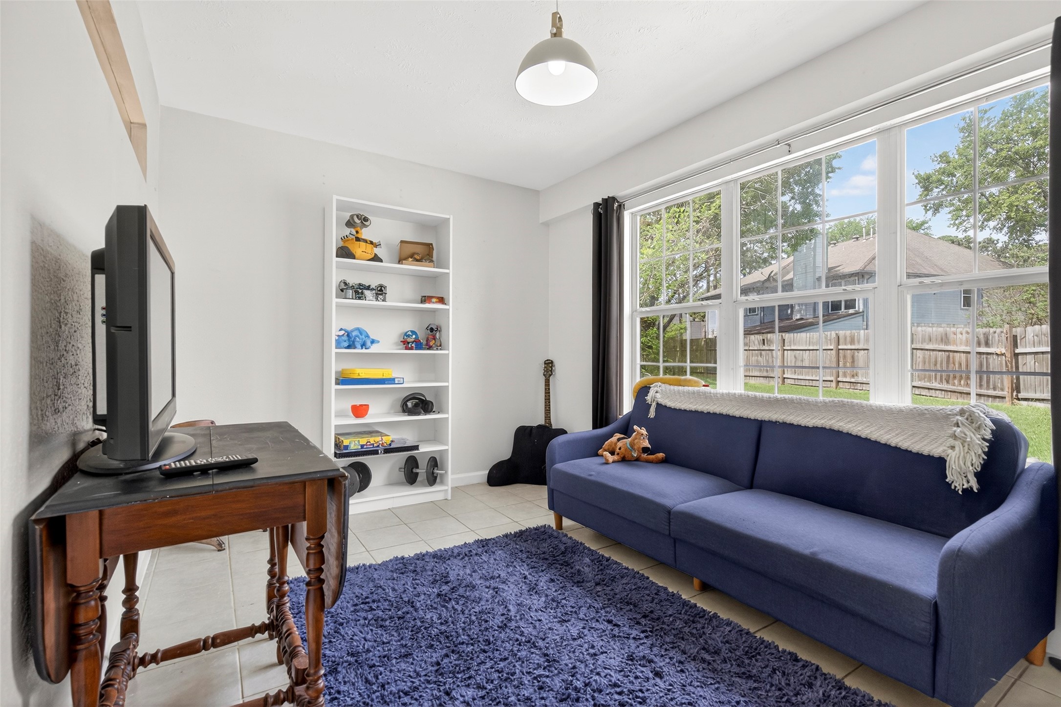 9206 Kirkleigh Lane Spring, TX 77379 - Photo 12 of 47 The flex room is set up as a child's playroom. It can also be a great office space with a view over the backyard.