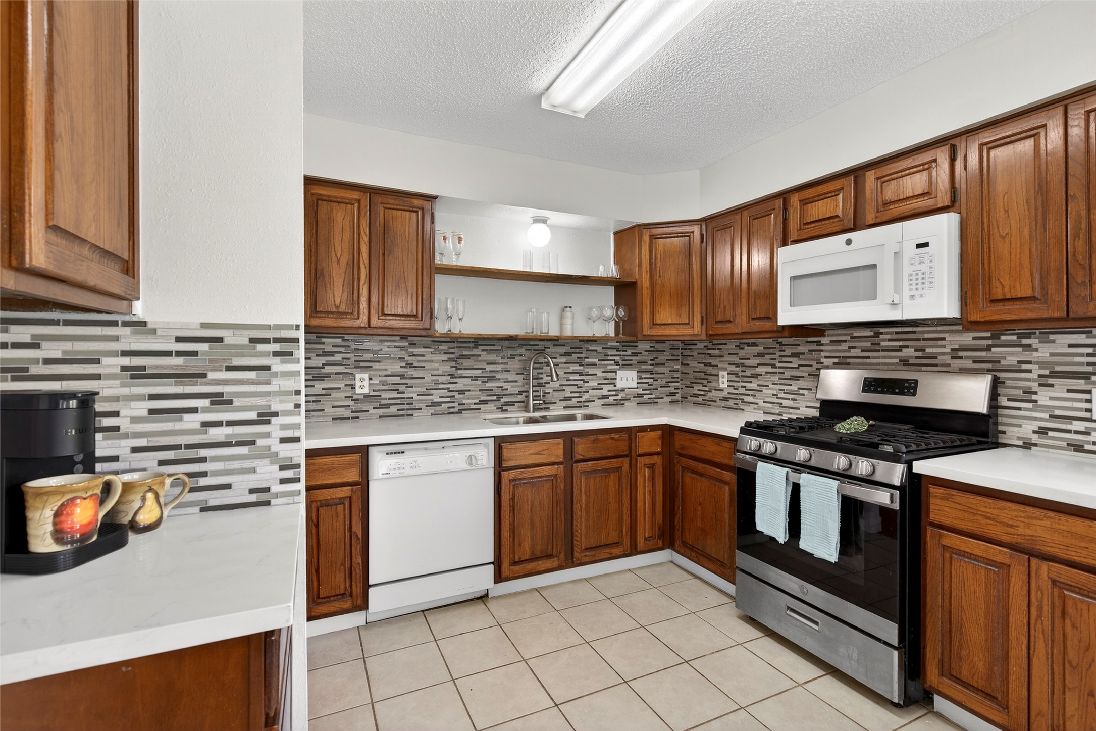 9206 Kirkleigh Lane Spring, TX 77379 - Photo 14 of 47 This kitchen offers ample cabinet space.