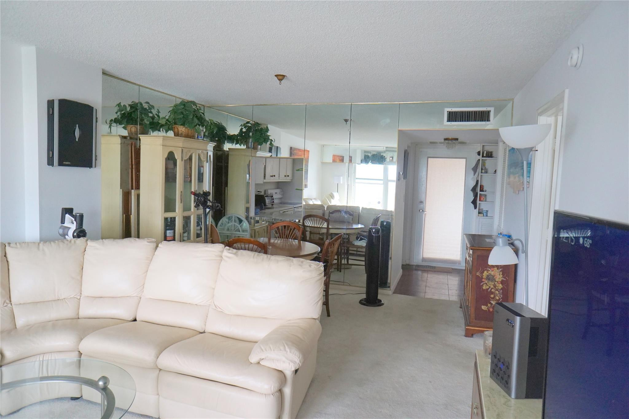 303 North Riverside Drive, Unit PH4 Pompano Beach, FL 33062 - Photo 8 of 52 a bed room with a bed window and a chair