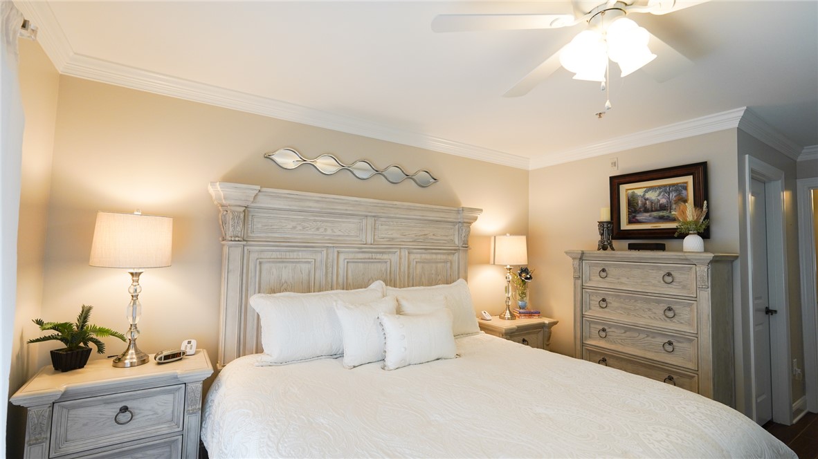 303 Lookover Drive Anderson, SC 29621 - Photo 36 of 46 This tranquil bedroom features elegant crown molding and a classic ceiling fan, perfect for restful nights.