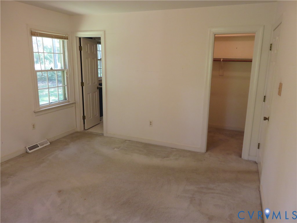 8379 Quailfield Road Mechanicsville, VA 23116 - Photo 39 of 56 an empty room with windows and closet
