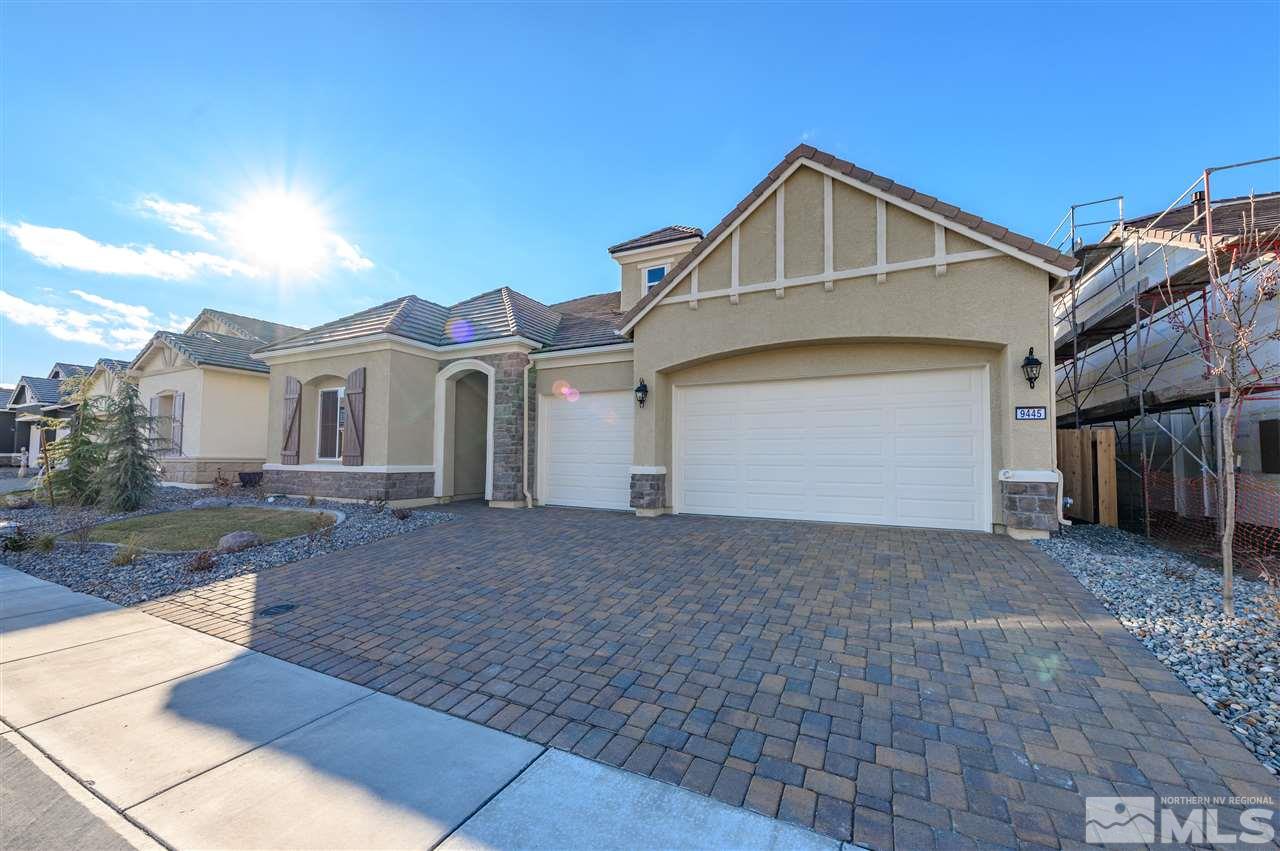 9445 Hawkshead Road, Unit HOMESITE 91 Reno, NV 89521 - Photo 3 of 27 a front view of a house with a yard and garage