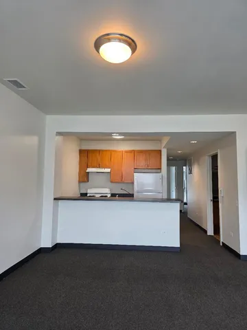 a kitchen with a sink and a mirror