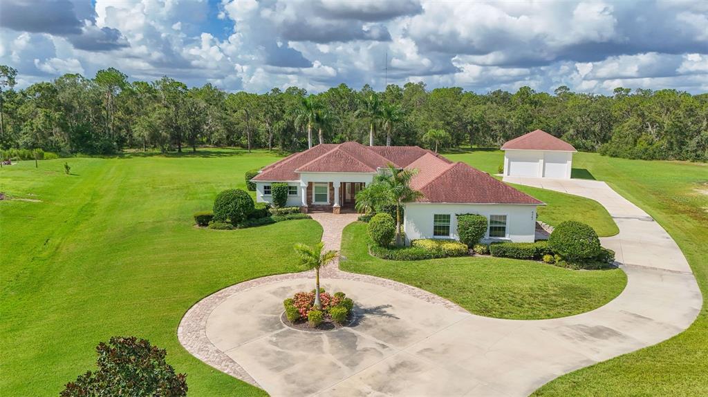 6367 Foxbrook Trail Parrish, FL 34219 - Photo 1 of 25 a front view of a house with a yard
