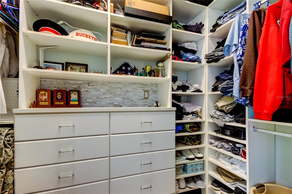 6367 Foxbrook Trail Parrish, FL 34219 - Photo 20 of 25 a view of walk in closet with clothes and shoes