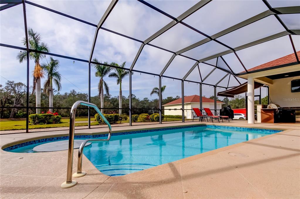 6367 Foxbrook Trail Parrish, FL 34219 - Photo 21 of 25 a view of a swimming pool with a porch
