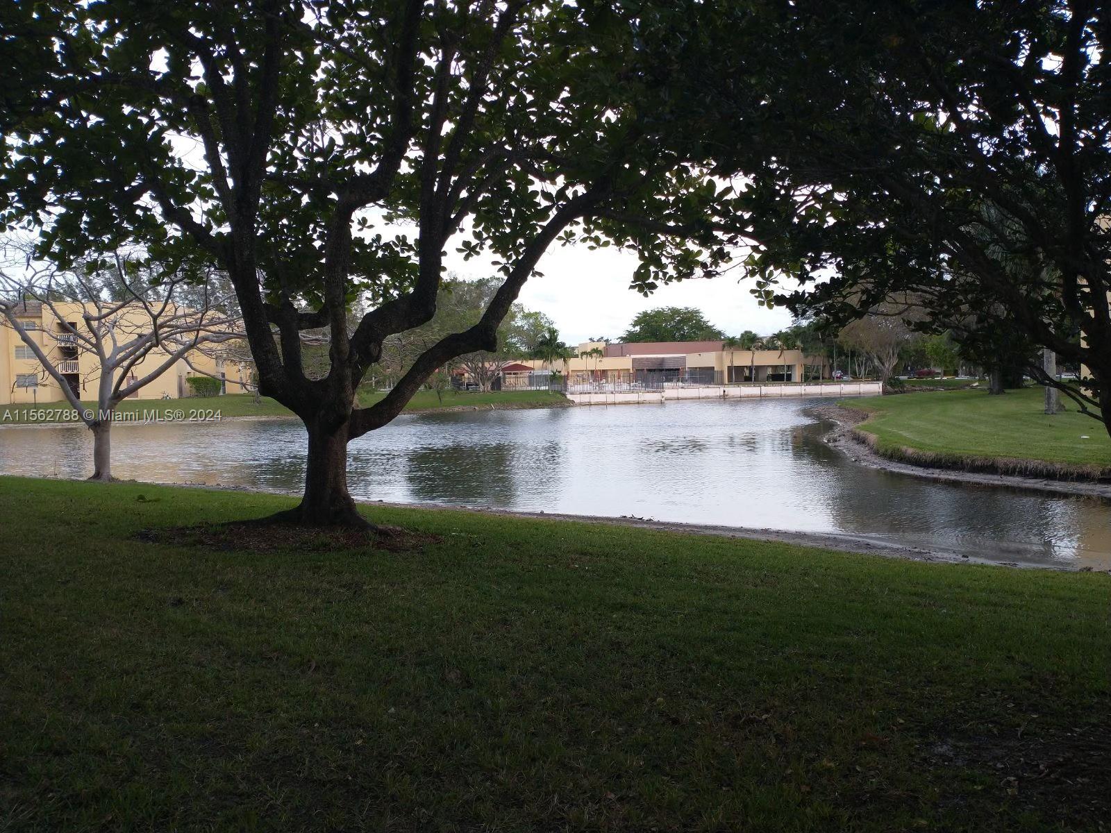 a view of lake with a yard