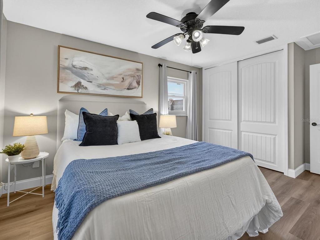 333 Cornwall Road Winter Park, FL 32792 - Photo 18 of 32 a bedroom with a bed and a chandelier
