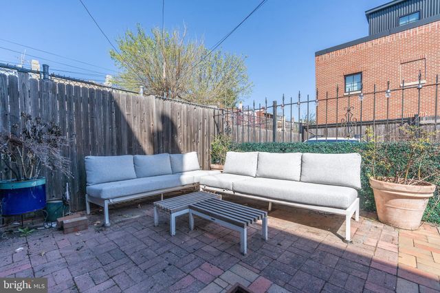 a outdoor living space with furniture and a couch