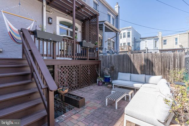 a view of a chairs and tables in the patio