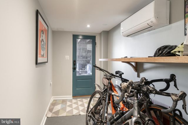 a view of a back yard of the house with cars parked