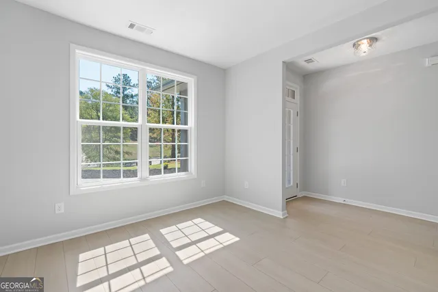 a view of a kitchen with a sink granite counter tops and a window