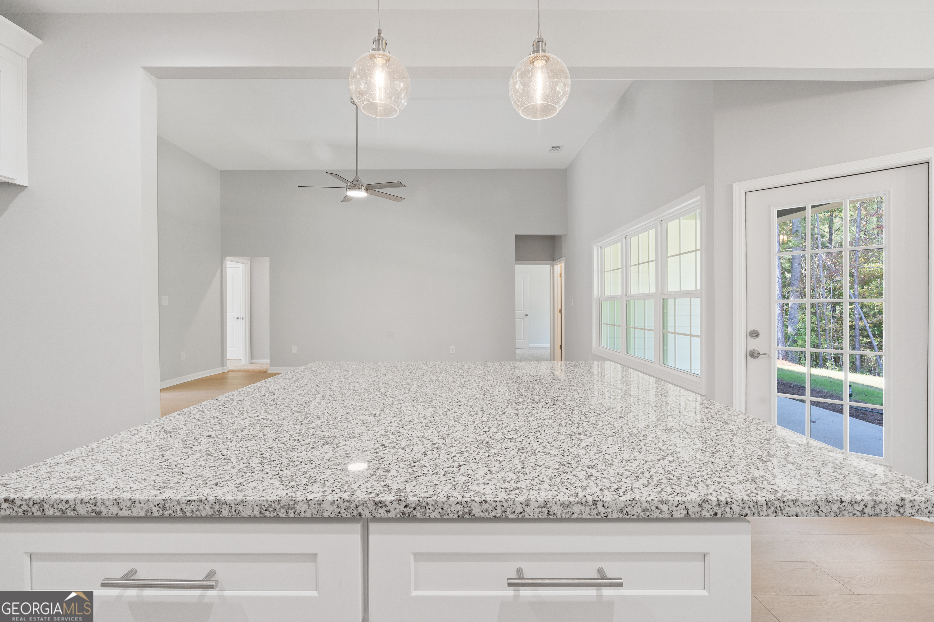 4477 Rivercliff Way Gray, GA 31032 - Photo 18 of 62 a view of a kitchen with a sink granite counter tops and a window
