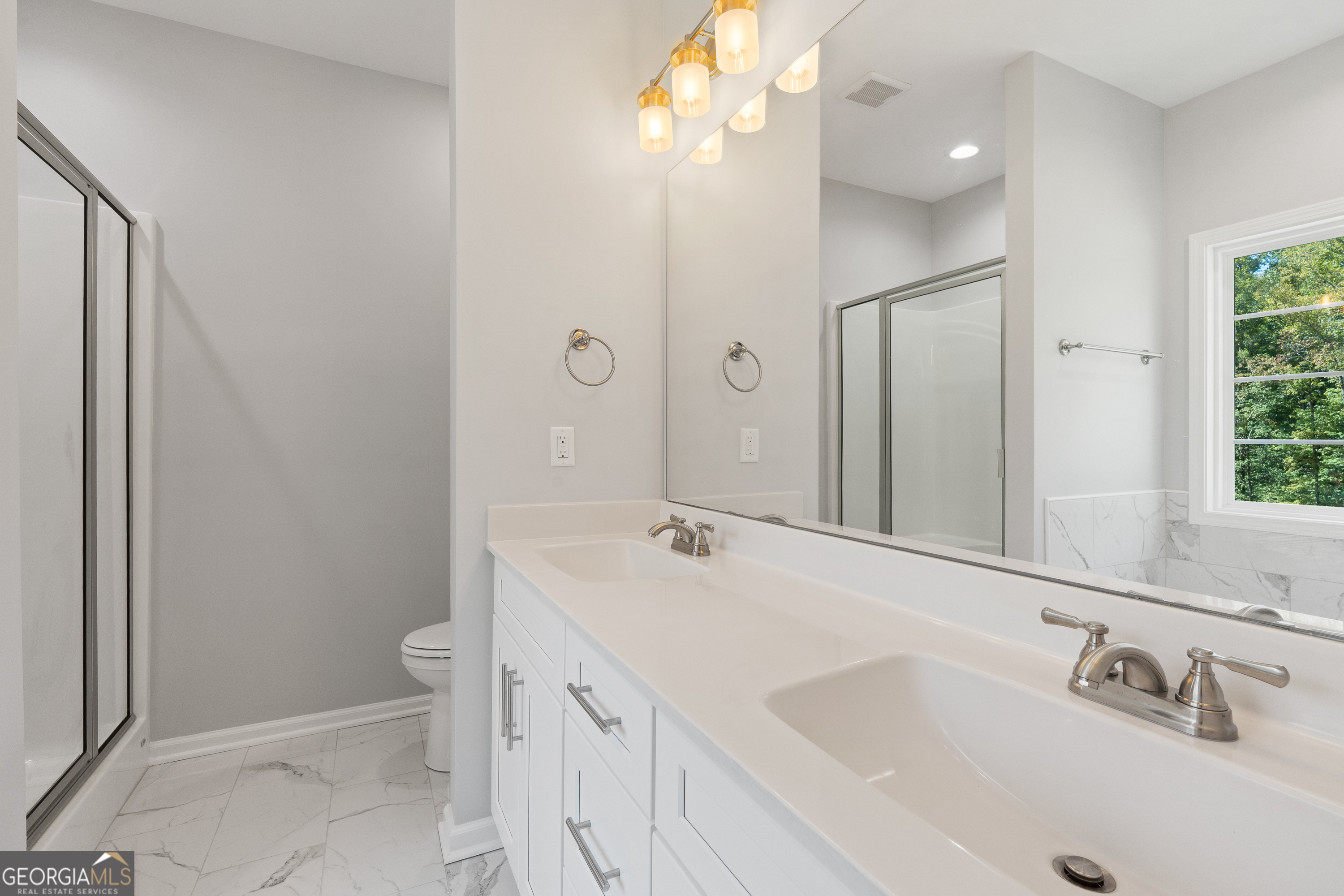 4477 Rivercliff Way Gray, GA 31032 - Photo 34 of 62 a bathroom with a sink a toilet and shower