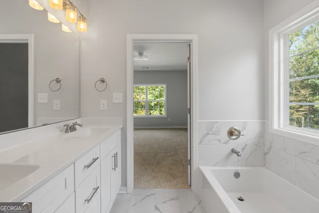 a bathroom with a sink toilet and bathtub