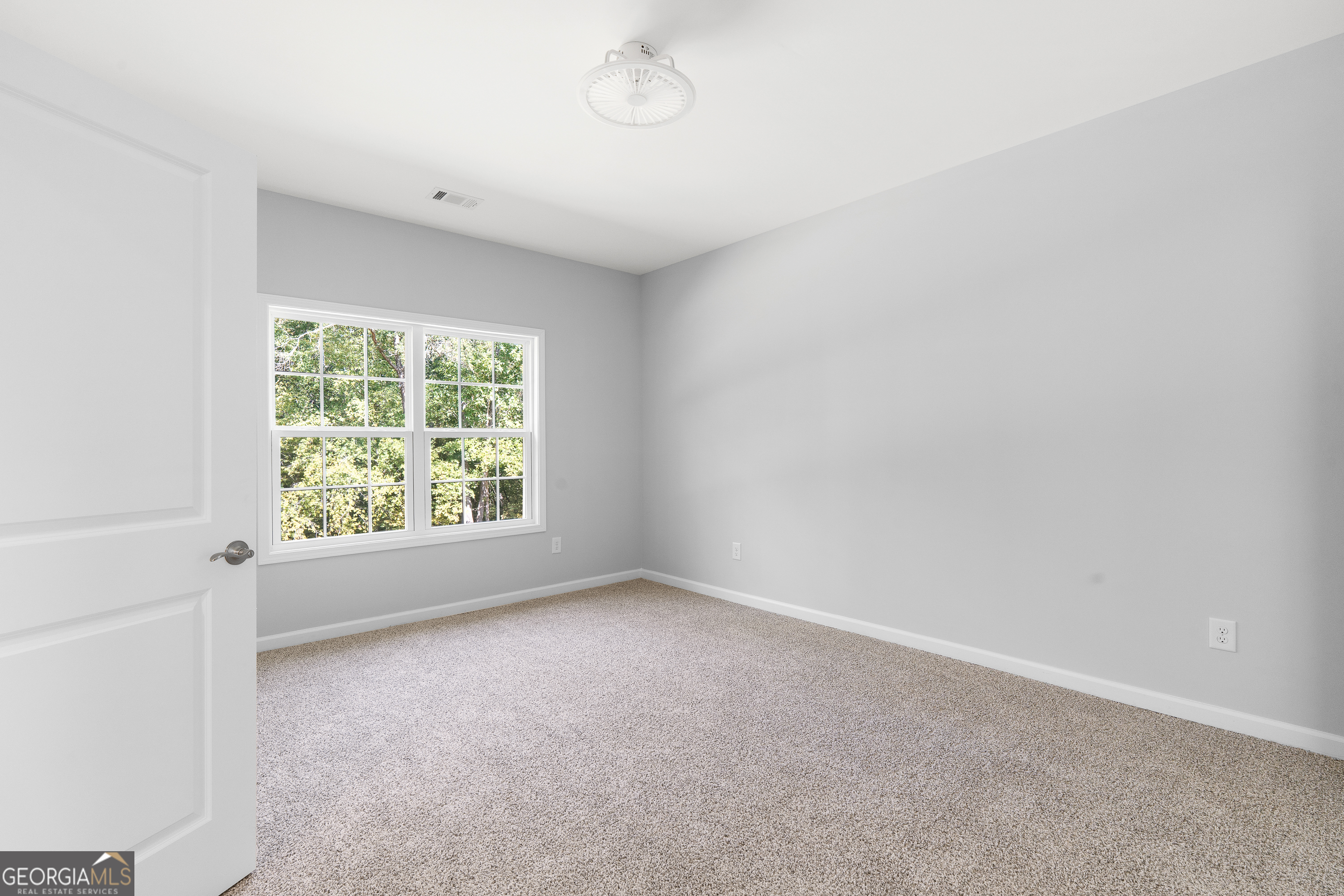 4477 Rivercliff Way Gray, GA 31032 - Photo 40 of 62 an empty room with windows