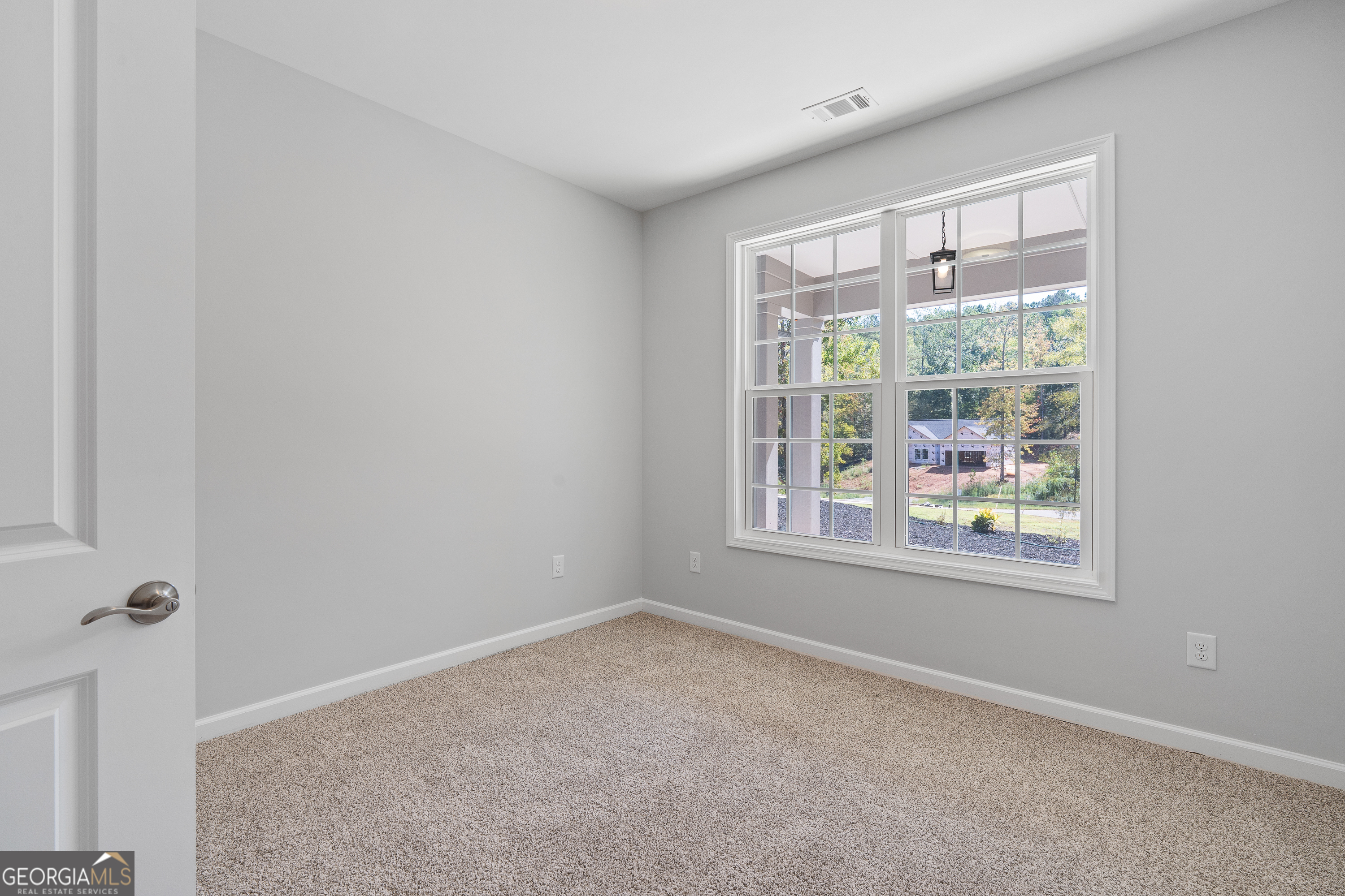 4477 Rivercliff Way Gray, GA 31032 - Photo 42 of 62 a view of an empty room with a window