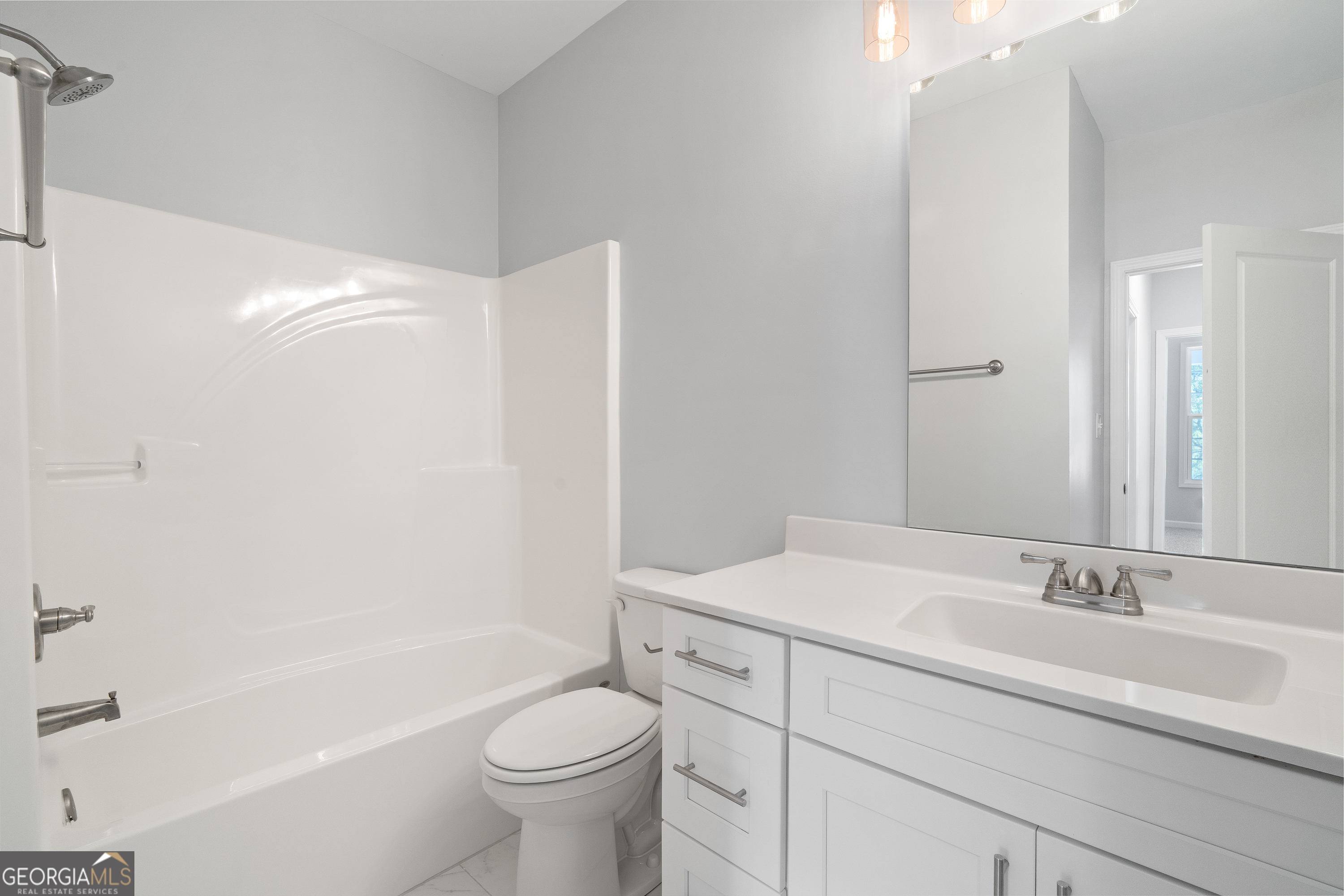 4477 Rivercliff Way Gray, GA 31032 - Photo 45 of 62 a bathroom with a sink a toilet and shower