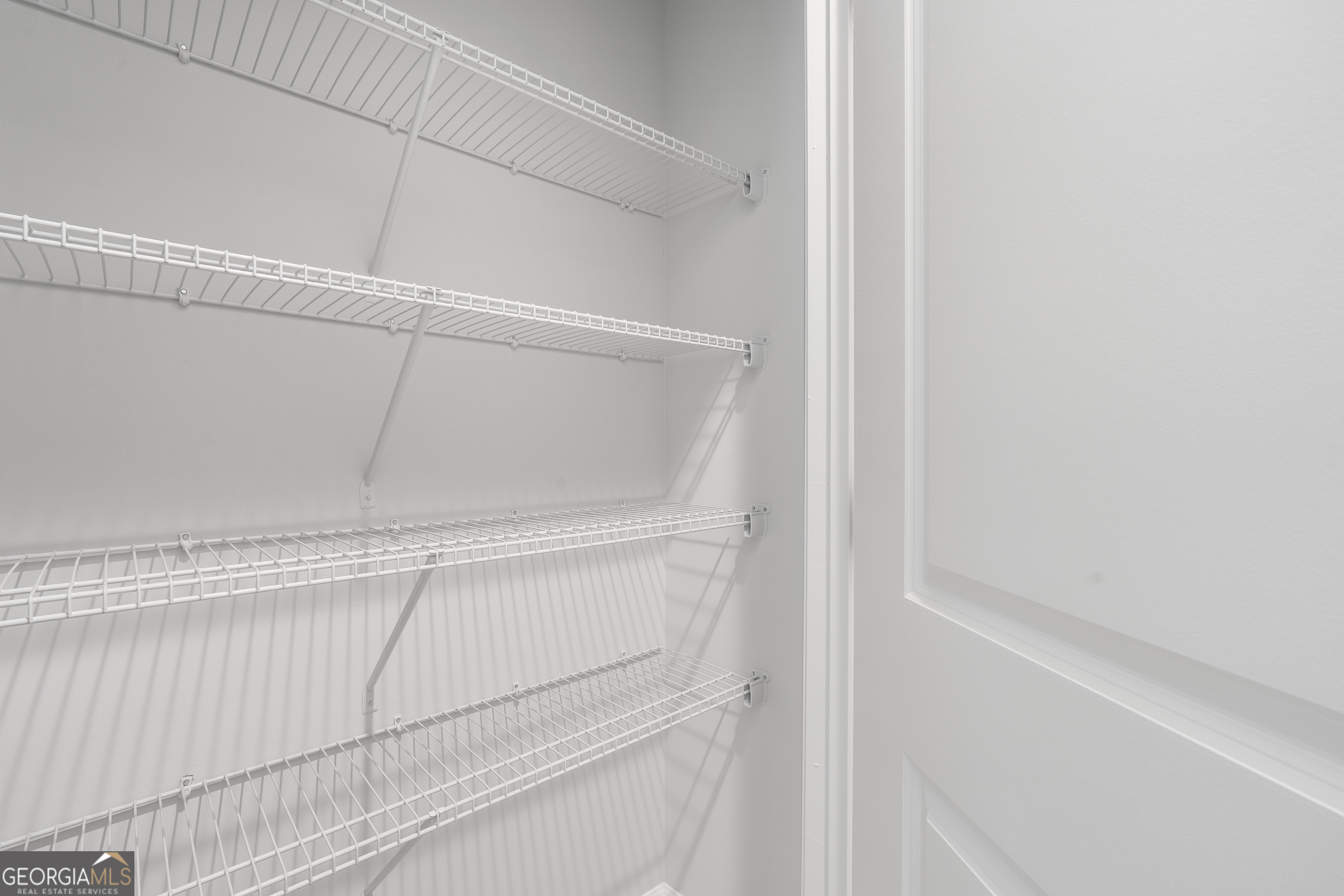 4477 Rivercliff Way Gray, GA 31032 - Photo 53 of 62 a close up view of racks on the wall