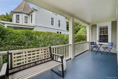 a balcony with wooden floor and outdoor space