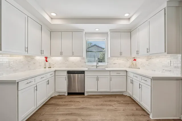 a kitchen with sink cabinets and window