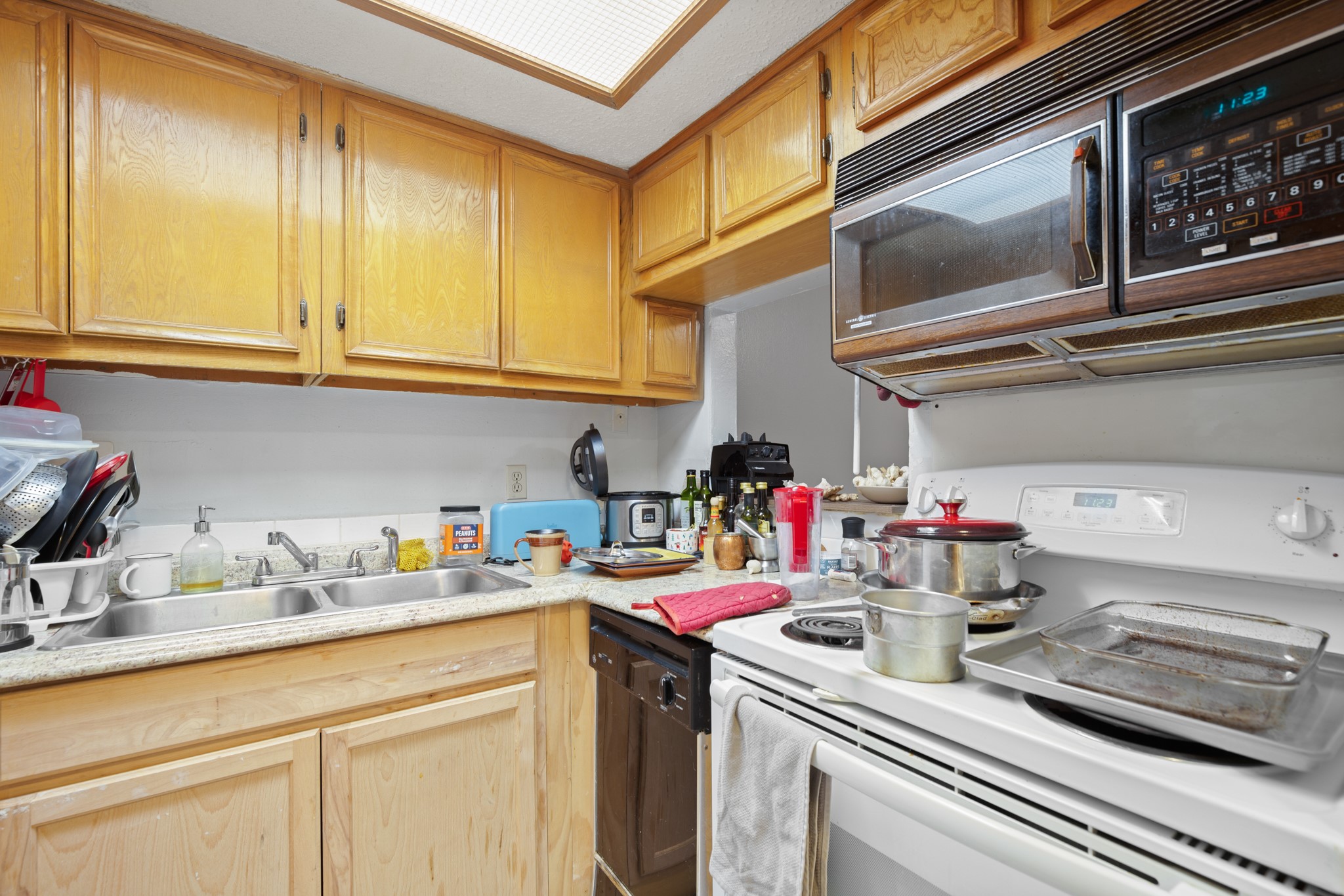 3506 Speedway, Unit 104 Austin, TX 78705 - Photo 4 of 9 a kitchen with sink cabinets and appliances