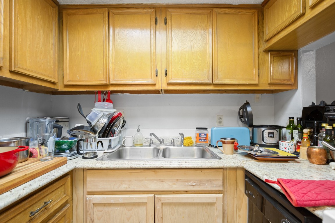 3506 Speedway, Unit 104 Austin, TX 78705 - Photo 5 of 9 Kitchen featuring light countertops and black dishwasher