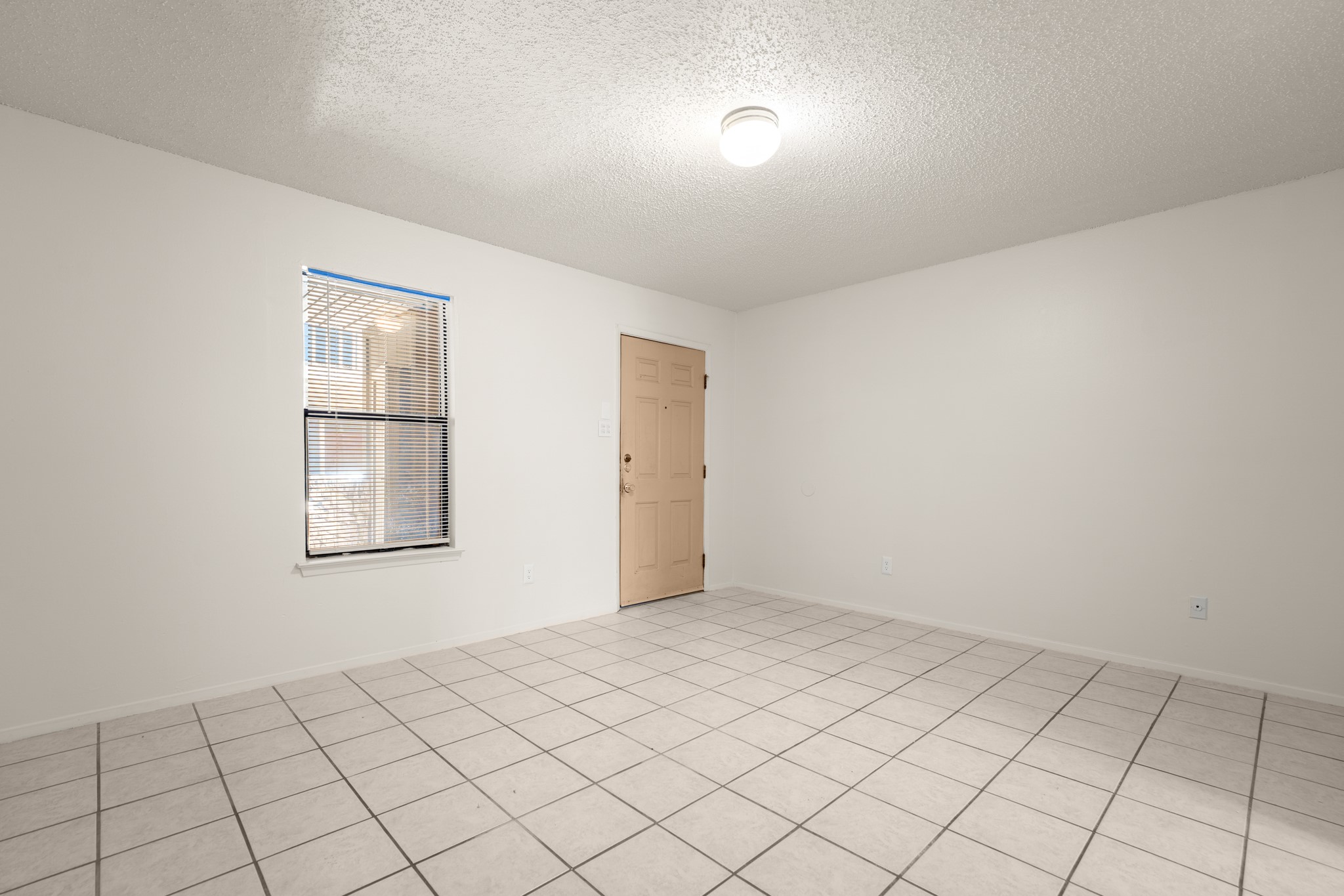 3506 Speedway, Unit 104 Austin, TX 78705 - Photo 5 of 10 a view of an empty room and window