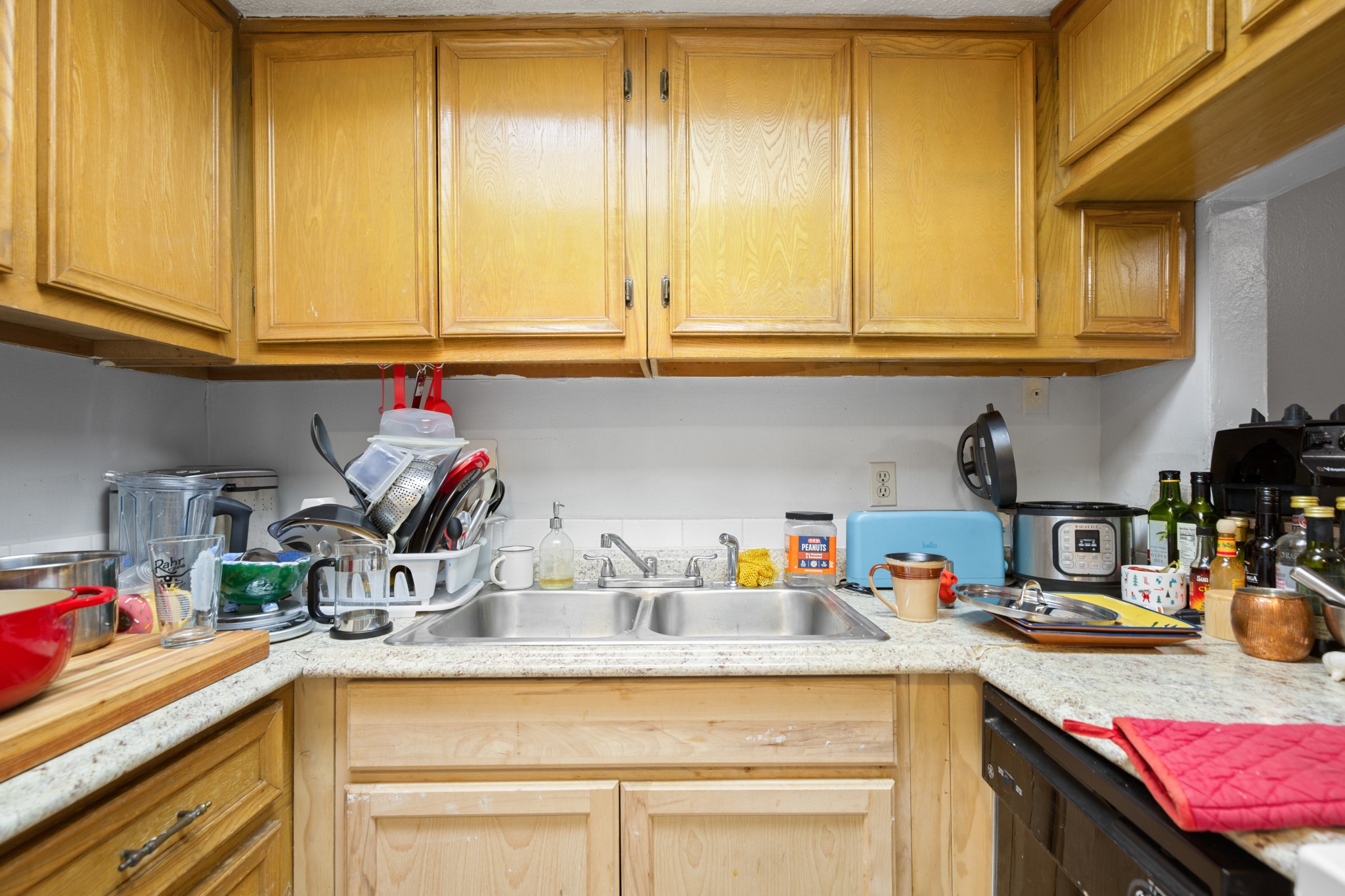 3506 Speedway, Unit 104 Austin, TX 78705 - Photo 5 of 9 a kitchen with stainless steel appliances granite countertop a sink and cabinets