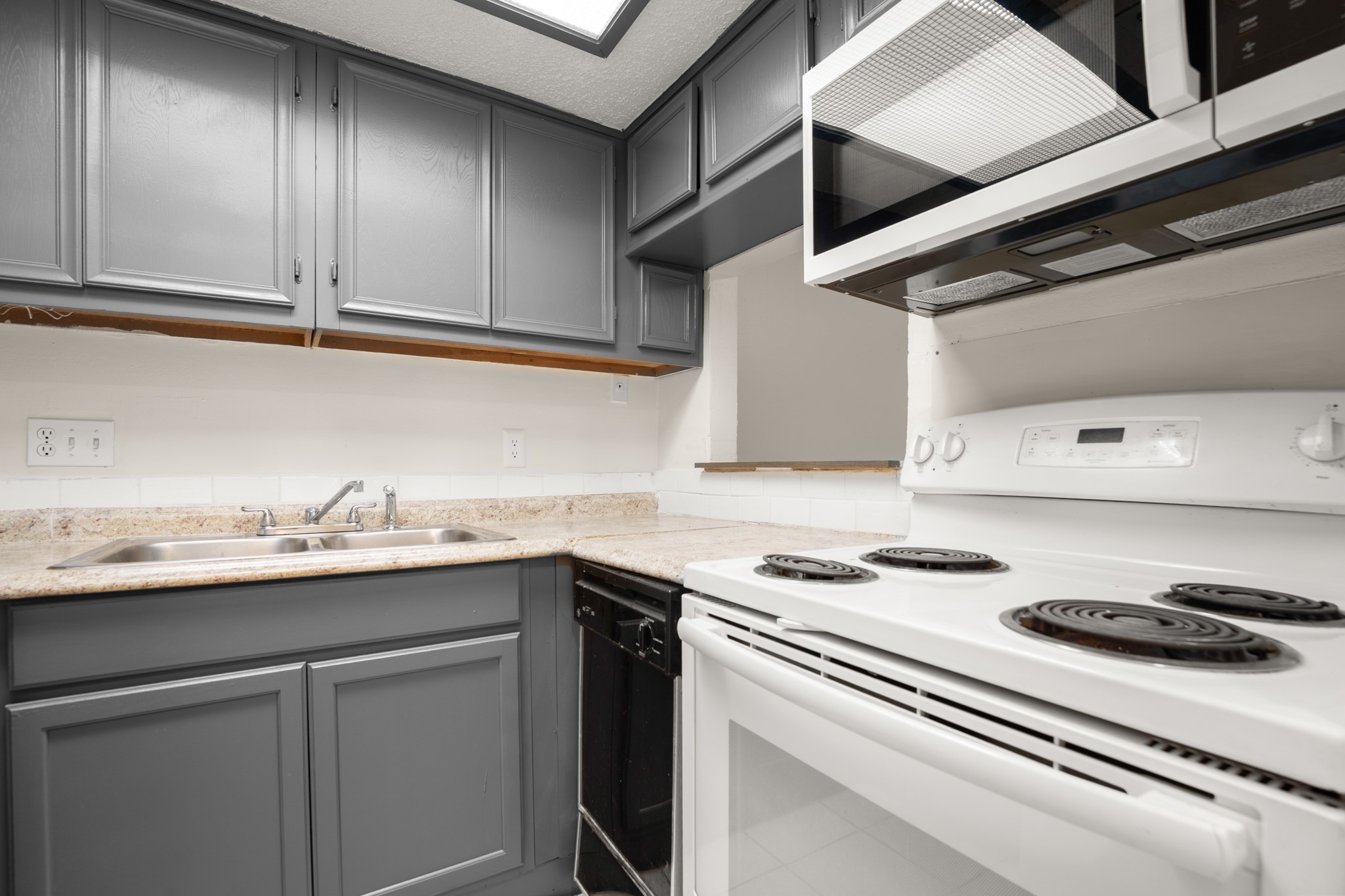 3506 Speedway, Unit 104 Austin, TX 78705 - Photo 7 of 10 a kitchen with stainless steel appliances granite countertop a sink and a stove