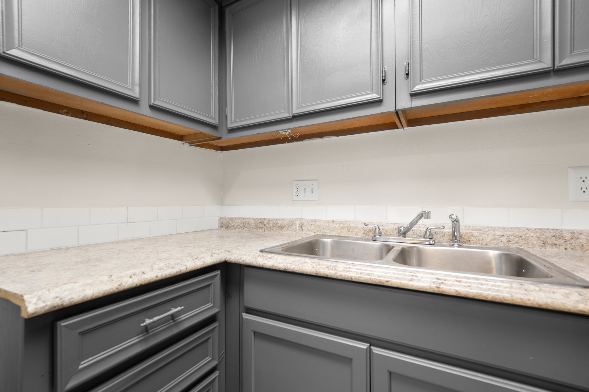 3506 Speedway, Unit 104 Austin, TX 78705 - Photo 8 of 10 a view with a sink and cabinets
