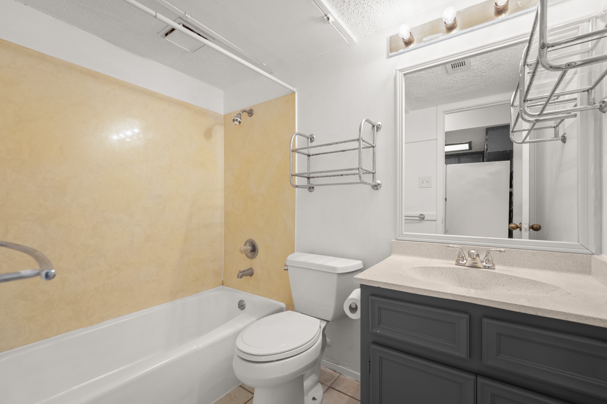 3506 Speedway, Unit 104 Austin, TX 78705 - Photo 9 of 10 a bathroom with a sink a toilet and shower