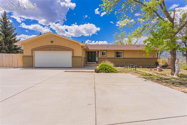 807 Fontmore Road Colorado Springs, CO 80904 - Photo 11 of 50 Ranch-style home featuring a garage