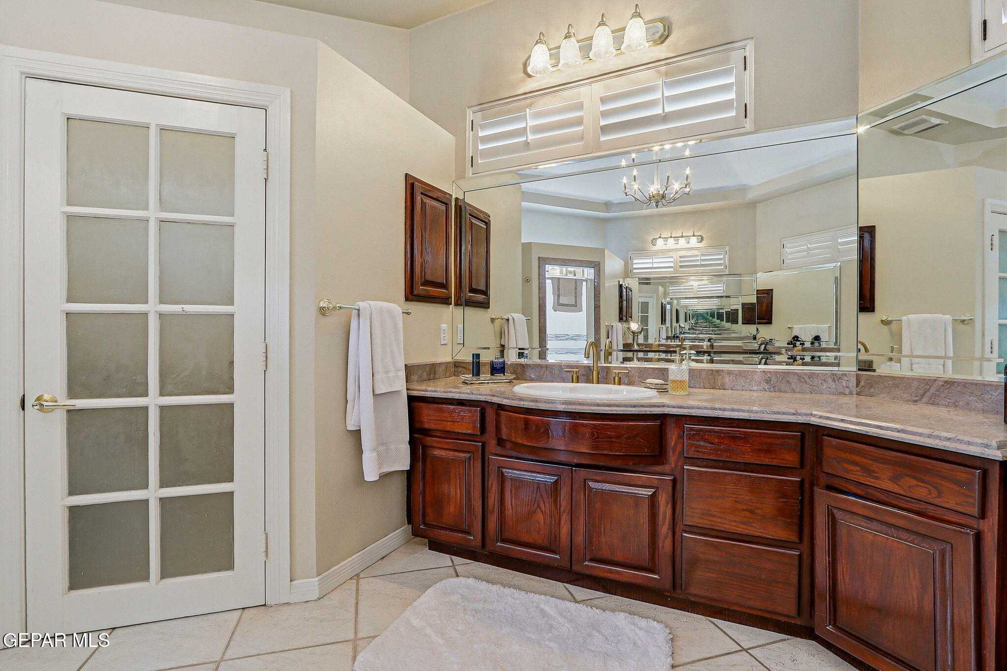 5806 Diamond Point Circle El Paso, TX 79912 - Photo 33 of 61 a bathroom with a sink double vanity and a mirror