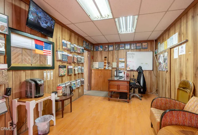 a bedroom with furniture and a large window