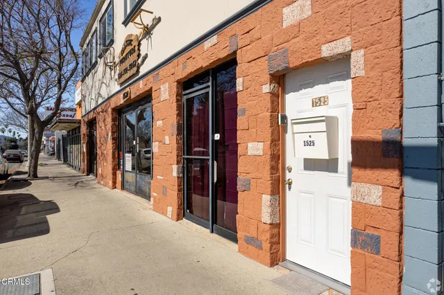 a view of a walk in front of building