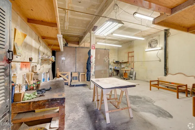 a room with table and chairs