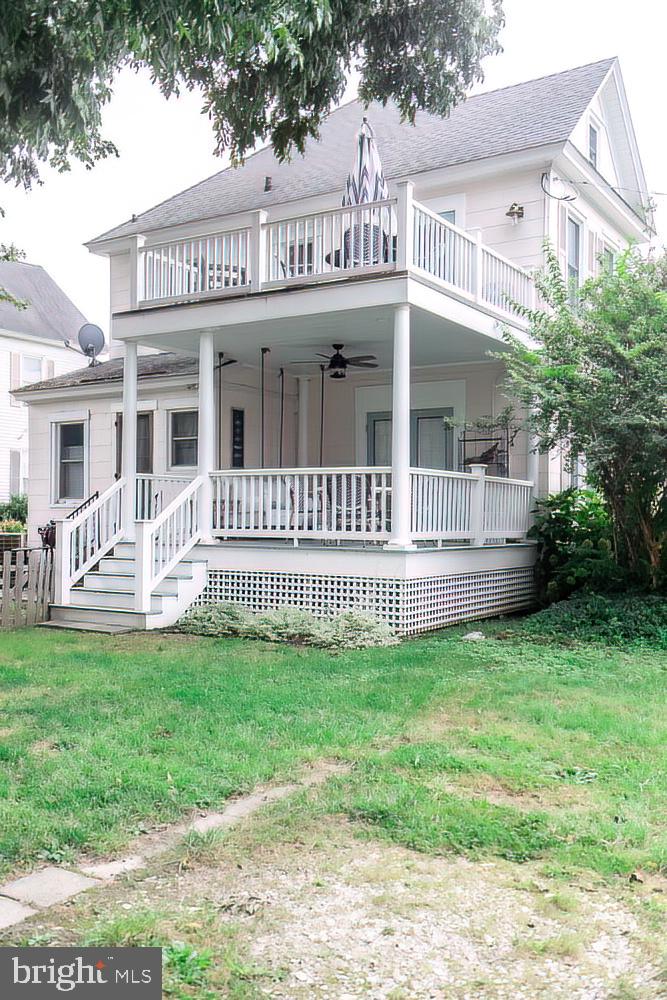 100 West End, Unit 1 Cambridge, MD 21613 - Photo 2 of 26 Spacious decks overlooking the backyard