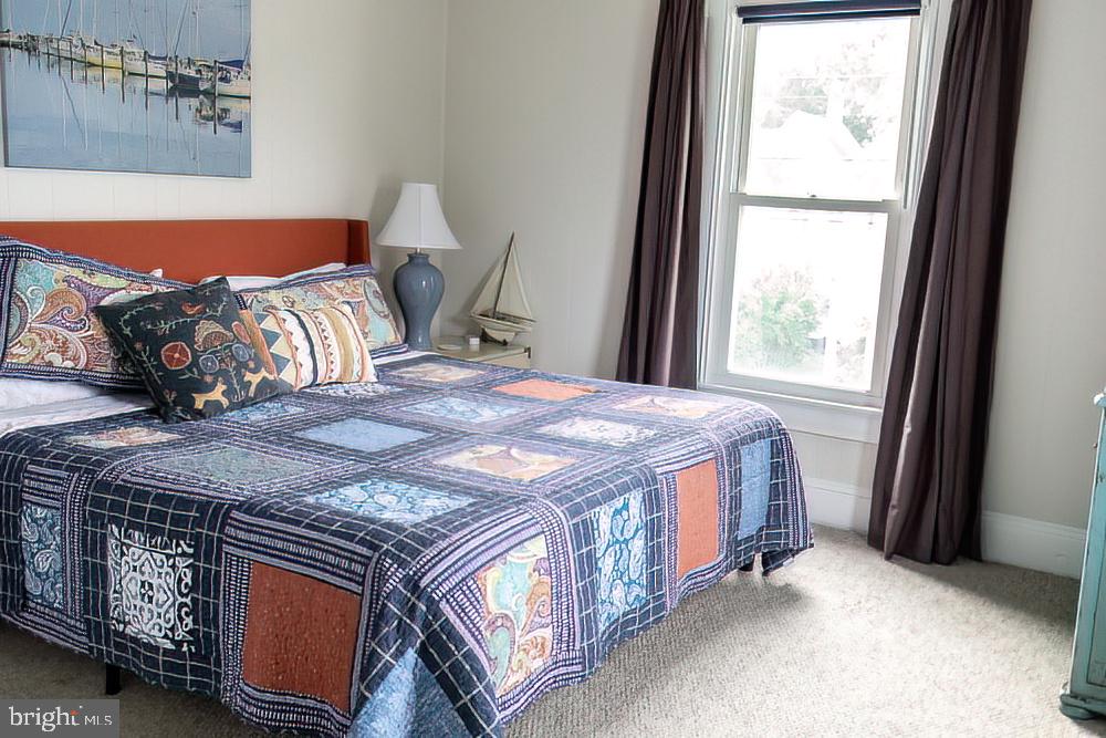 100 West End, Unit 1 Cambridge, MD 21613 - Photo 9 of 26 Spacious bedroom.
