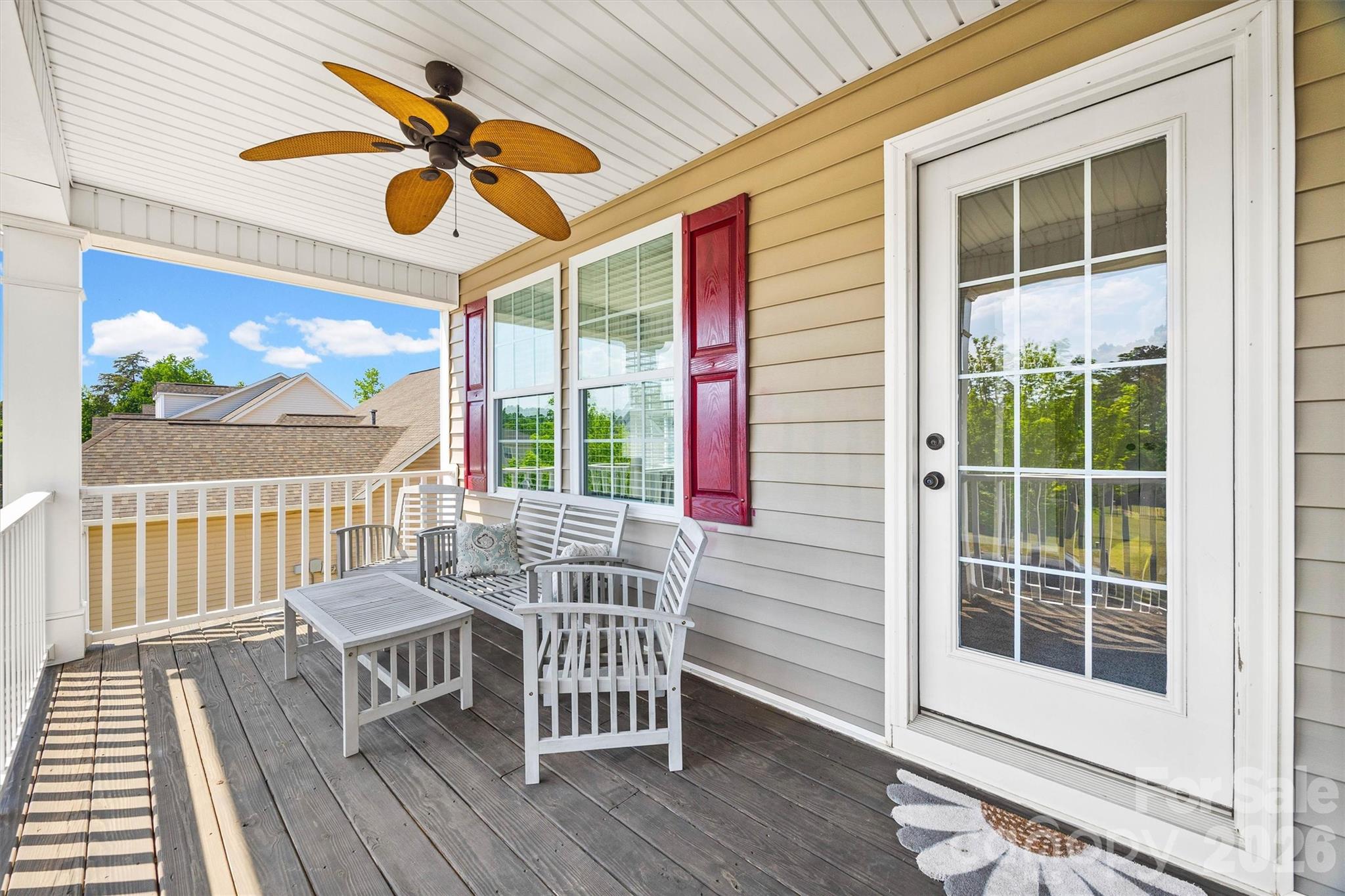 299 Annatto Way Tega Cay, SC 29708 - Photo 40 of 46 a view of a chairs and table on the deck