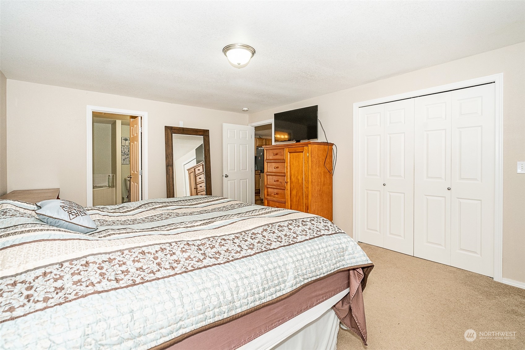 330-38 Brockway Road Chehalis, WA 98532 - Photo 18 of 40 a bedroom with a bed and a flat screen tv