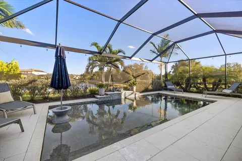 a view of swimming pool with a chair
