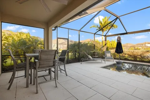 a very nice looking dining room with a table and chairs