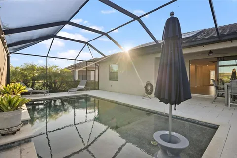 an empty room with closet and a ceiling fan
