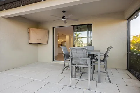 a bathroom with a granite countertop sink a mirror and a shower