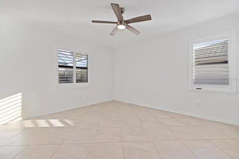 a bathroom with a granite countertop sink double and mirror