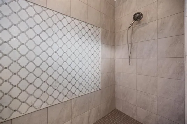 a bathroom with a granite countertop toilet a sink and bathtub